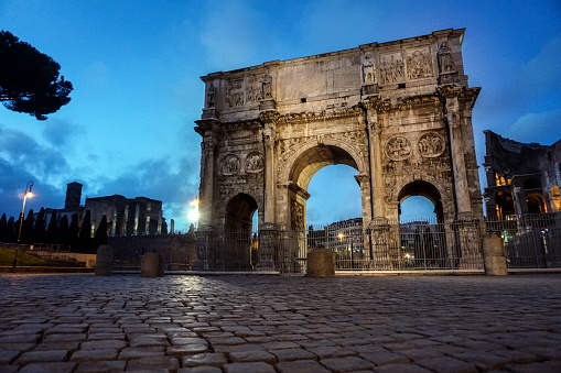 Arch of Constantine or Arco di Costantino at night in Rome, Italy