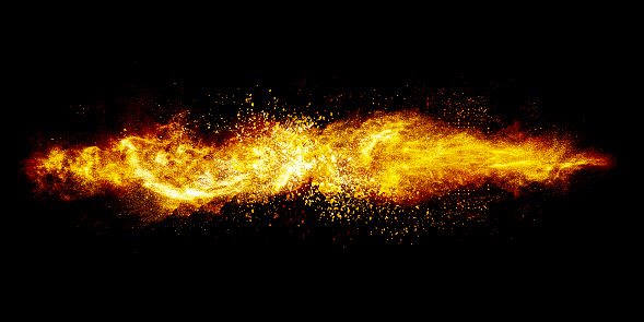Abstract exploding yellow powder isolated on black background.