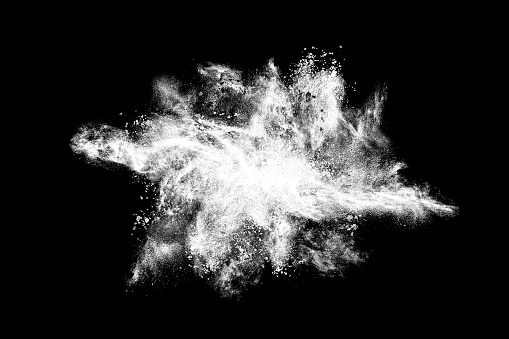 Abstract exploding white powder isolated on black background.