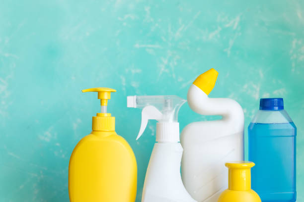 istock Professional cleaning equipment on blue background overview. Cleaning tools concept. composition with Plastic detergent bottles. House cleaning products.Detergents, chemical bottles, cleaning sponges 1383076996