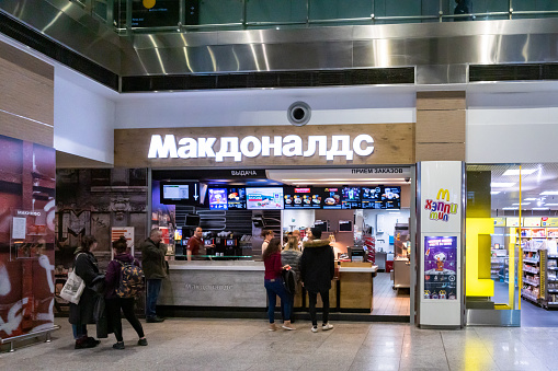 Saint Petersburg, Russia - May 2019: McDonald's restaurant in Saint Petersburg airport. American corporation business operating in Russia.