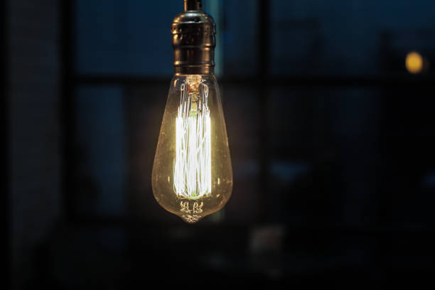 istock Classic edison lamp on a dark background. Cafe interior element. Mock-up 1383081747