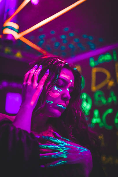 istock Female Dancing During Neon Light Party 1383090316