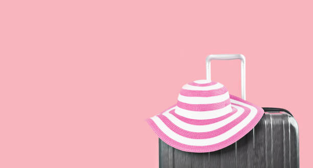 istock Luggage Suitcase and Pink Sun Hat 1383090317