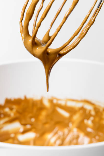 istock Wire whisk with whipped cream. Dalgona coffee preparation 1383091092