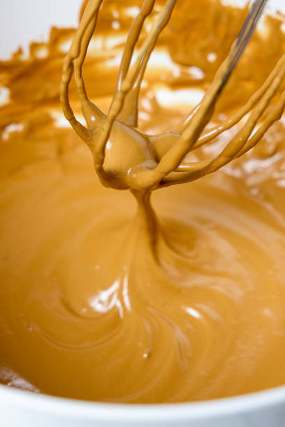 istock Wire whisk with whipped cream. Dalgona coffee preparation 1383091131