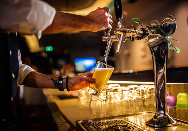 Bartender preparing cocktails and coffee stock photo