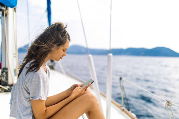 istock Girl enjoying on sailing 1383092528