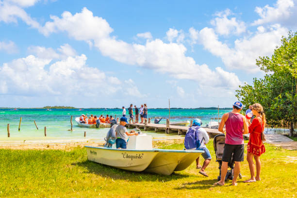 Muyil Mexico 02. February 2022 Panorama view to the Muyil Lagoon in the tropical jungle nature forest with boats people in Sian Ka'an National park Muyil Chunyaxche Quintana Roo Mexico.