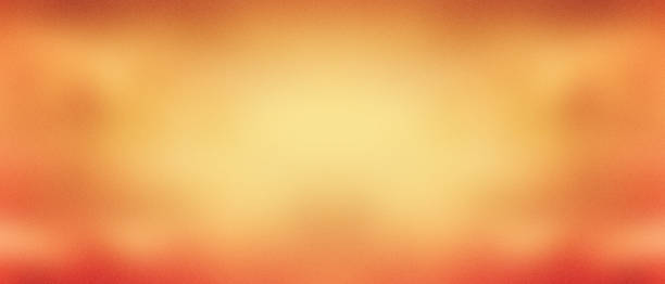 istock Orange and yellow gritty blurred gradient background with retro vintage dusty overlay texture and soft grain pattern in warm sunny fall colors abstract panorama banner header design 1383094094