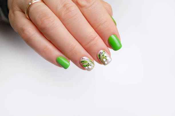 istock Beautiful female hand with spring manicure. 1383096521