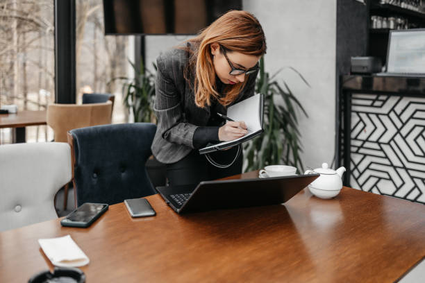istock Businesswoman using smart phone 1383097455