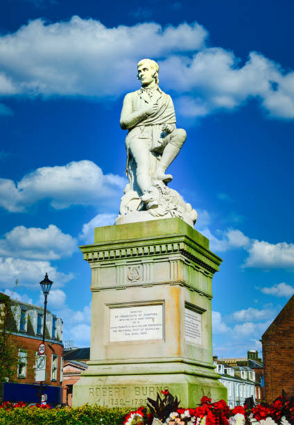 istock Robbie Burns statue on blue sky at Dumfries, Scotland. 1383097632