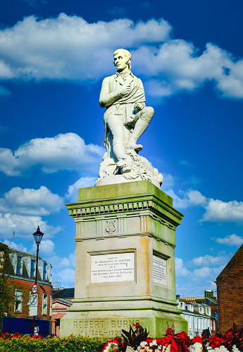 Robbie Burns statue on blue sky at Dumfries, Scotland.
