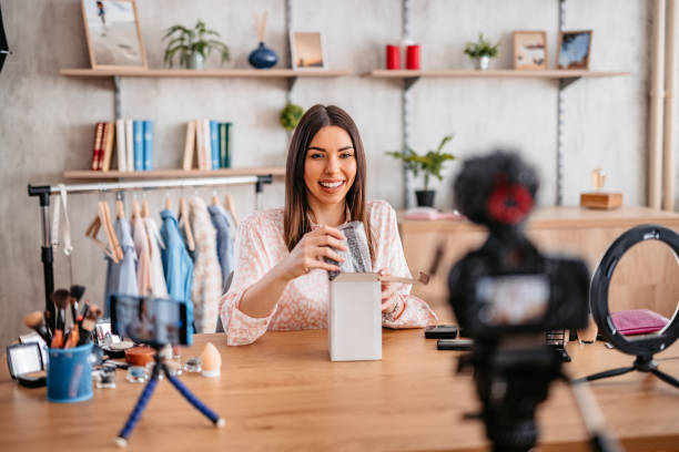 istock Woman unboxing in live video 1383100140