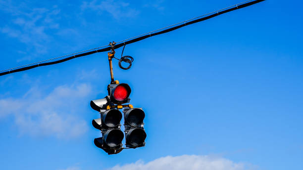 istock Traffic lighs with blue sky and some clouds 1383101052