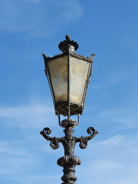 istock Streetlamp in front of a blue sky 1383102308