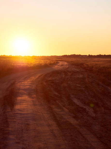 istock Autumn field with road. 1383104555