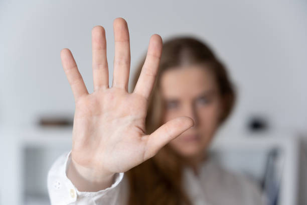 Woman making stop sign Woman making stop sign with hand. Domestic and sexual violence concept self defense stock pictures, royalty-free photos & images
