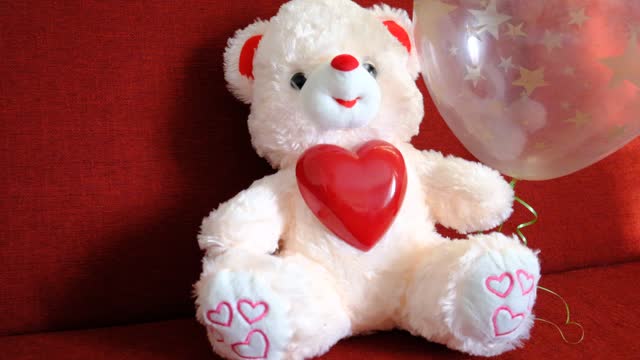 Toy bear with a heart.  Preparation for a romantic holiday at home, soft morning light. Valentines Day, Birthday  and love Concept