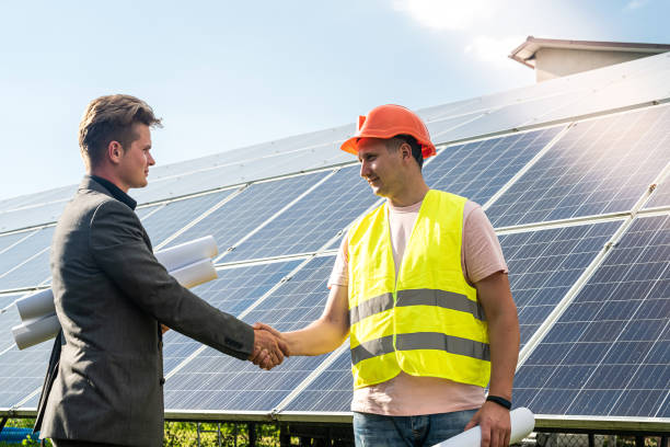 istock Project manager and worker finished installation of solar panels 1383108185