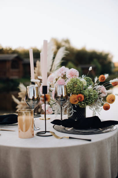 istock Organize a romantic dinner for two outside in the boho style 1383108947