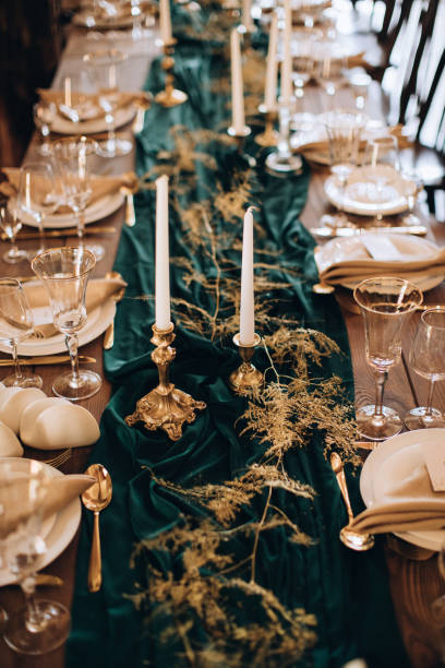 istock Decorated elegant wooden wedding table in rustic style with candles 1383109051