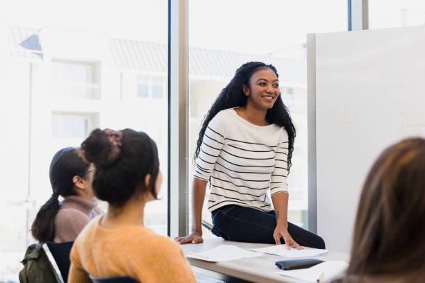 istock Student teacher listens to student 1383109293