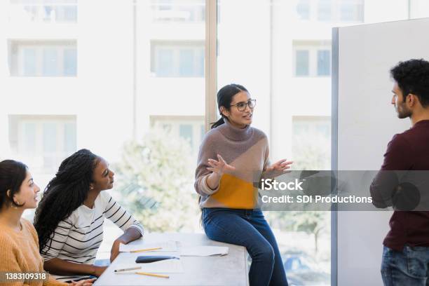 Teacher Explains The Assignment Stock Photo - Download Image Now - Leadership, Curiosity, Student