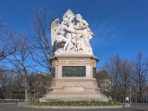 Basel, Switzerland - December 14, 2019: Strassburger memorial also known as Switzerland Succoring Strasbourg. It was unveiled on October 20, 1895 in memory of the help the civil population of Strassburg received from Switzerland during the Franco-Prussian war in 1870-1871. The monument was modeled by the French sculptor and painter Frederic Auguste Bartholdi (1834-1904).