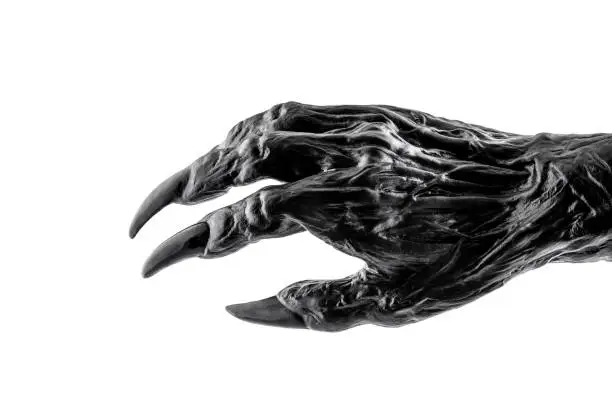 Photo of Creepy monster hand isolated on white background with clipping path