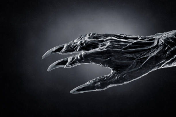 istock Creepy monster claw over dark misty background 1383111529