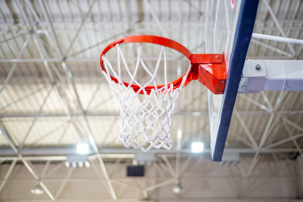 istock Basketball hoop in indoor gym. 1383111661