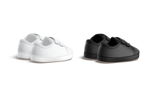 istock Blank black and white baby shoes pair mockup, back view 1383111844