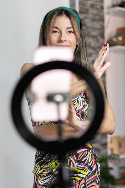 istock Woman trainer streaming a dance session at home. Vertical 1383111997