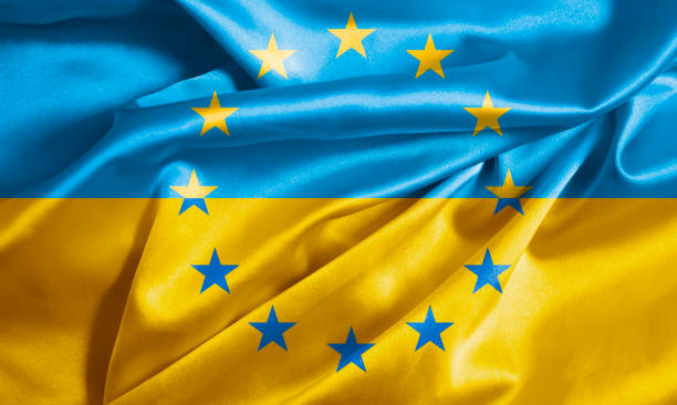 istock Ukraine flag and EU flag 1383112747