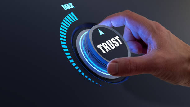 trust in business and finance relationships. trusted partner, contract, agreement or assurance concept. confidence to work together, trustworthy company. person turning knob to max value. - trust stockfoto's en -beelden