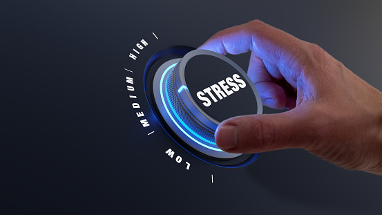 Reduce stress with hand turning knob to lower levels. Burnout, exhaustion, overload, pressure at the workplace and management concept. Relieve tension.