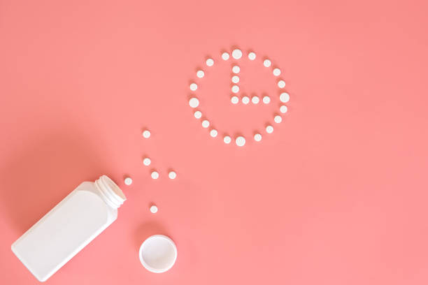 istock Flat lay, pills on a pink background, conceptual minimalism, medicine. 1383113719