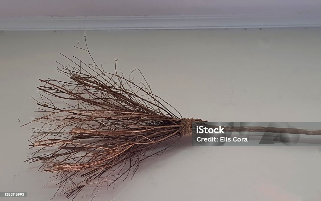 Witch's broom for Halloween on a wall of a mystical shop. Decoration Stock Photo