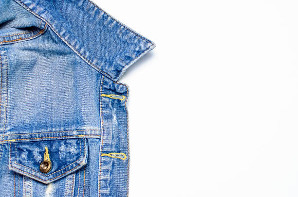 istock Close-up Blue denim jacket on isolated white background top view flat lay copy space. Denim, fashionable jacket, women's or men's trend clothing, fashion background. Denim texture 1383116457