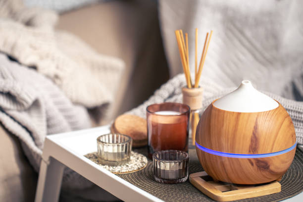 istock A cozy composition with an aroma diffuser and candles in a home interior. 1383117672