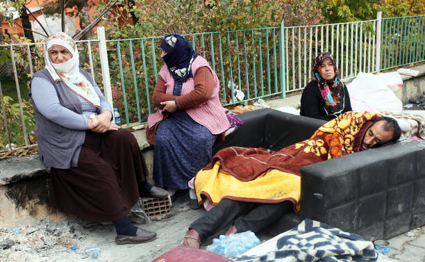 earthquake victims people sleeping outside - earthquake turkey stockfoto's en -beelden
