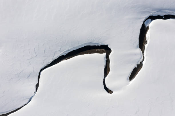 istock Aerial view of a small river in winter 1383118746