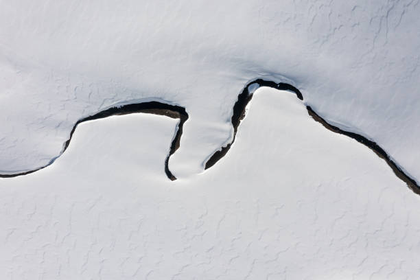 Top view of a small stream in a winter landscape