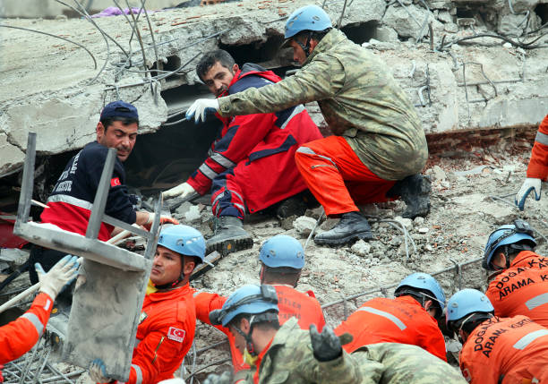 rescue team is searching for the wounded under the debris - van imagens e fotografias de stock