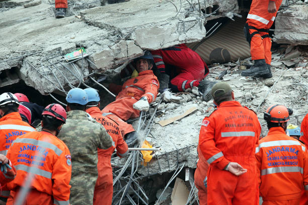 rescue team is searching for the wounded under the debris - van imagens e fotografias de stock