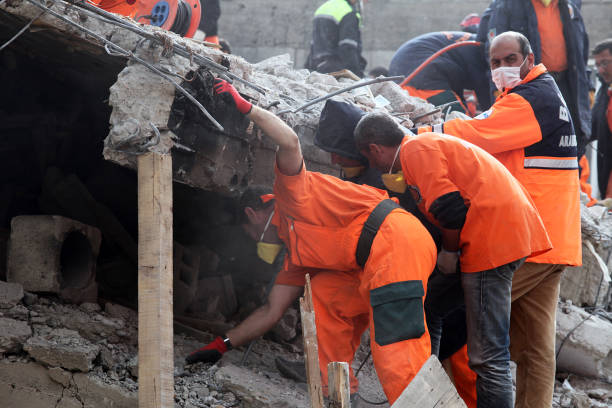 Rescue team is searching for the wounded under the debris stock photo