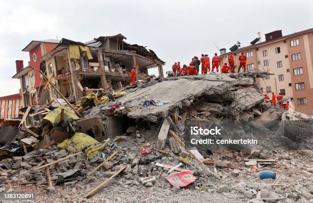 Rescue Team Is Searching For The Wounded Under The Debris Stock Photo - Download Image Now
