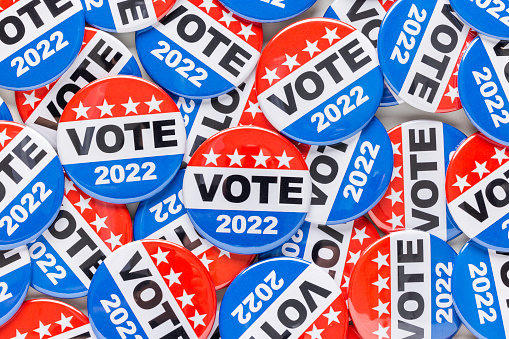 High quality stock photos of vote campaign buttons with room for copy and with an American Flag.